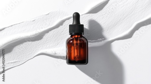 Amber glass dropper bottle on white smear