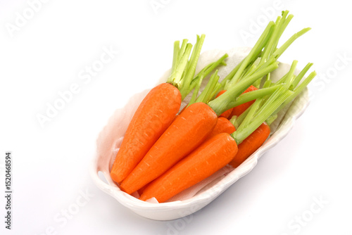 Organic mini carrots isolated on white background.