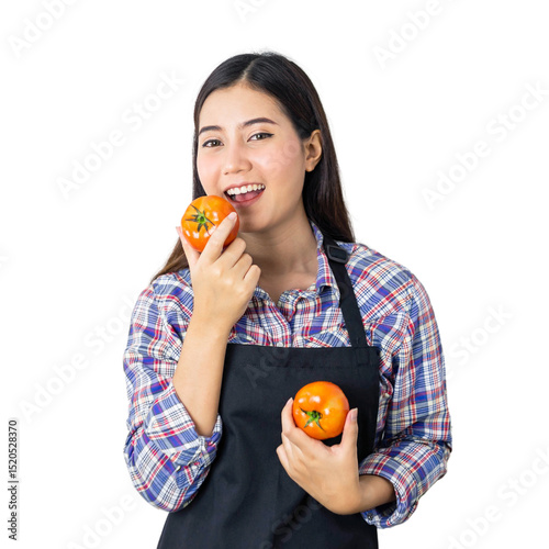 Young Asian woman wearing apron holding fresh tomatoes and smiling, isolated on a transparent background, healthy eating, organic farming, fresh vegetables, and natural food lifestyle concept