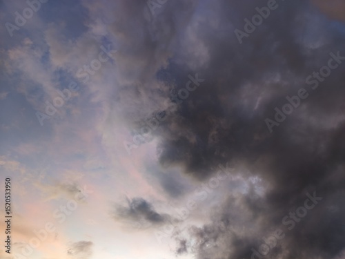 A dramatic sky filled with heavy, dark storm clouds, hinting at impending weather change