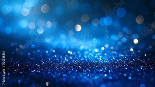 Shimmering blue bokeh with glittering particles