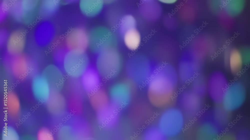 Abstract colorful bokeh background with bright glowing light effects motion