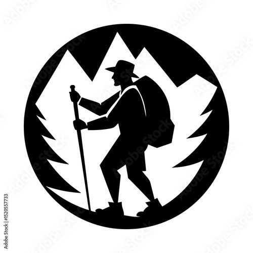 Silhouette of a hiker with backpack and walking stick in mountain scene