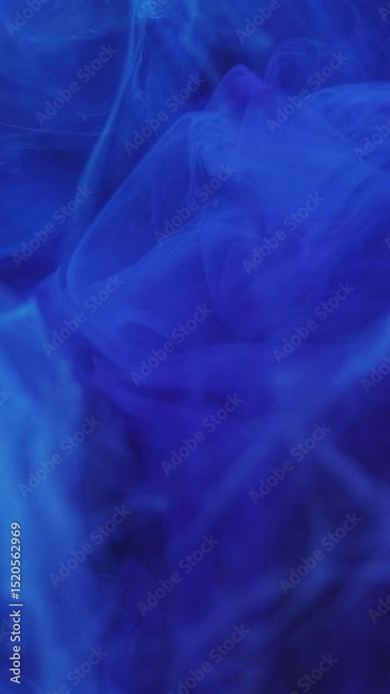 Vertical video. Dream cloud. Shining color. Defocused bright blue splash paint ink mist magic smoke moving on abstract modern art background.