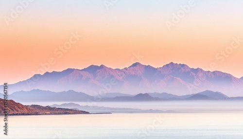 Serene mountain sunrise over water