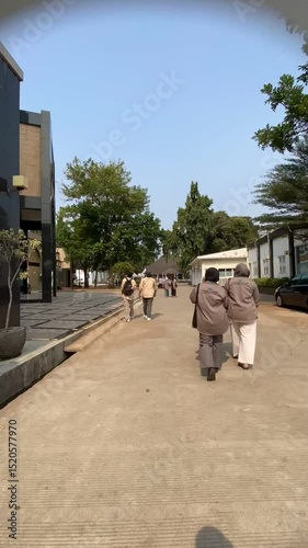 man and woman, people walking on the street. A man and a woman can be seen walking on the street.
