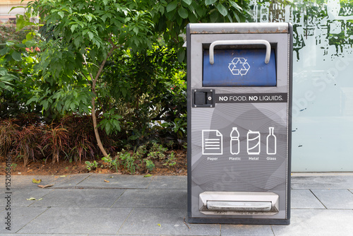 Recycling bin with clear instructions for waste disposal in Orchard Road