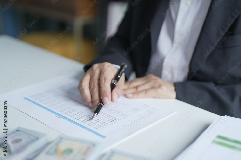 Fototapeta premium Businesswoman Accountant analyzing investment charts Invoice documents. Accounting Bookkeeper Clerk Bank Advisor And Auditor