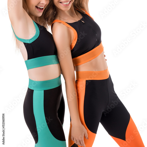 Two friends wearing stylish workout outfits in vibrant colors