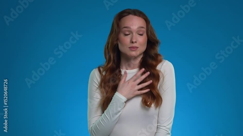 Woman expresses deep emotion while posing in a studio setting