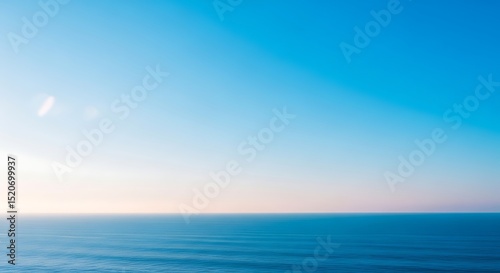 Wallpaper Mural Serene Ocean Horizon A Peaceful Blue Sky and Calm Sea Torontodigital.ca