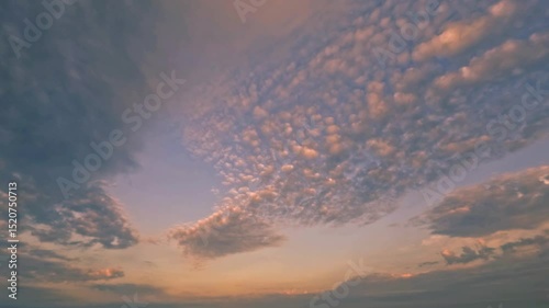 sky timelapse of fluffy clouds at sunset after the rain for forecast