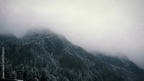 Time-lapse mist moving on snow mountain. 