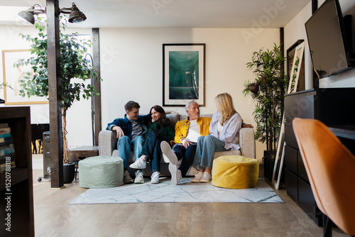 Family relaxing and bonding in a cozy living room photo