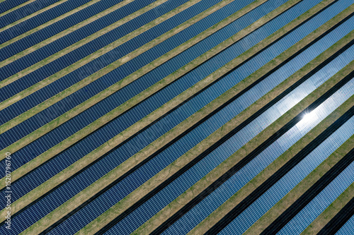 Solar panels farm in Germany, drone aerial view on a sunny day