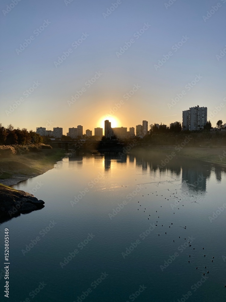 Naklejka premium sunset over the river