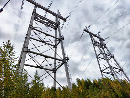 Krasnoyarsk Hydroelectric Power Station towers towering above the landscape under a cloudy sky
