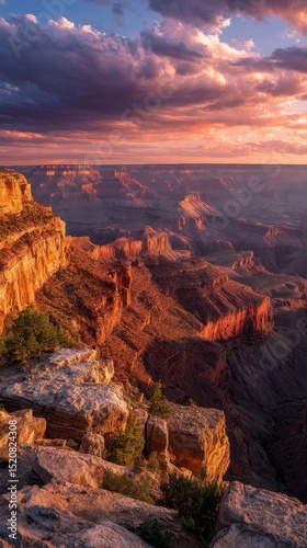 First light on the Colorado Plateau, pink and orange sky washing over wide open desert and distant cliffs