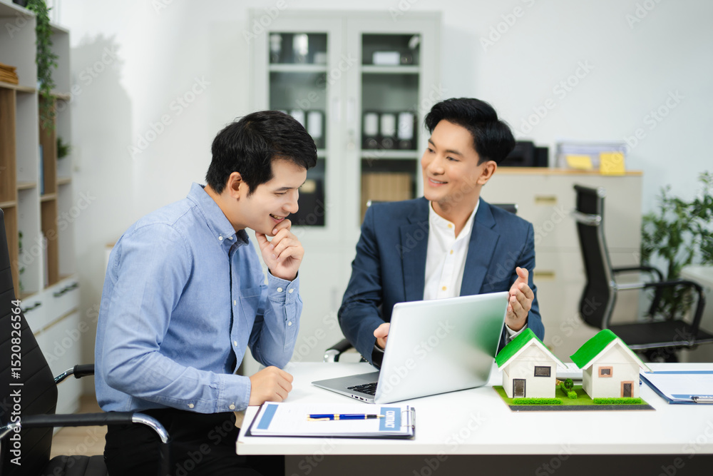 Professional team collaboration in modern office, discussing real estate model and signing contract, concept of startup Professional team collaboration in modern office, discussing real estate model and signing contract, concept of startup