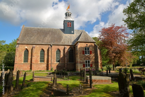 The church Slotkapel in Egmond aan den Hoef, Bergen, Netherlands, surrounded by the cemetery and located close to the old Castle of Egmond