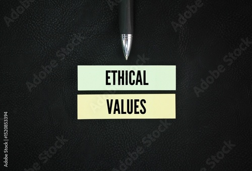 Colored pen and paper with the word ethical values. the core moral principles that guide how individuals and groups should behave, differentiating right from wrong.