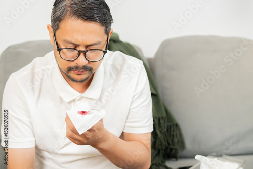 Mature ill male coughing up blood and sore throat causes of cough include pneumonia, bronchitis, allergy, asthma or COPD.