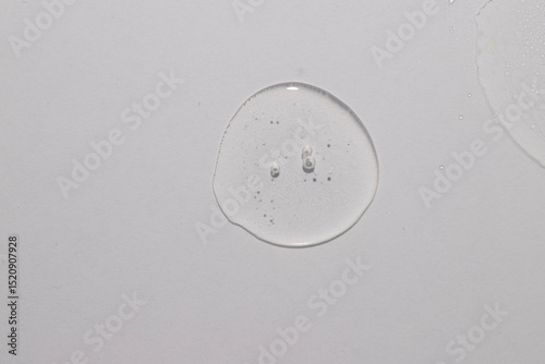 Top view of trasparent  circule dropl place, serum toner cream swatch texture