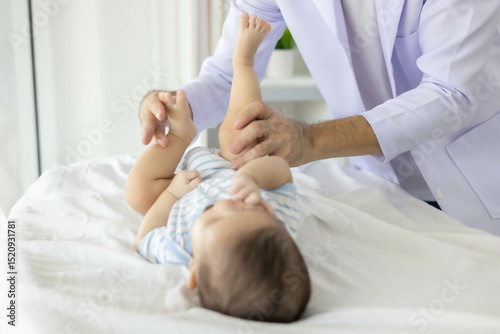 The doctor examines the baby by holding and moving the baby in various positions, checking the baby's cries, and using a stethoscope to check the baby's internal symptoms.


