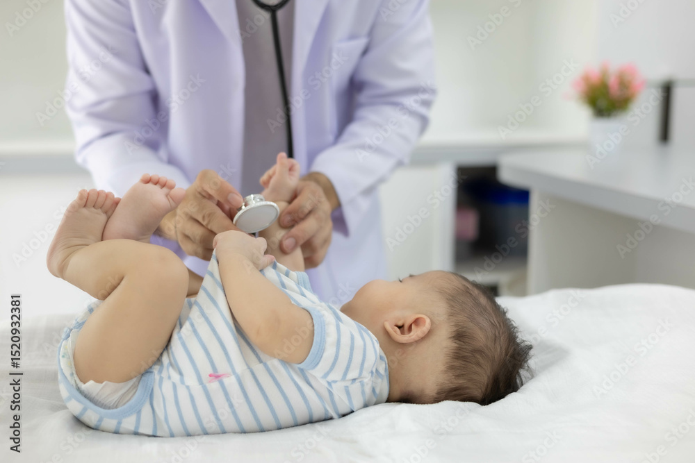Fototapeta premium The doctor examines the baby by holding and moving the baby in various positions, checking the baby's cries, and using a stethoscope to check the baby's internal symptoms.