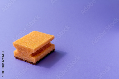 one yellow sponge on the violet background.