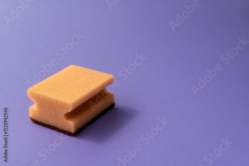 one dish sponge on the violet background.