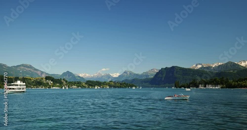 Wallpaper Mural 30-05-2025 Lucerne, Switzerland. Swiss Alps and lake view from aboard tourist ferry boat. Sunny summer day, middle of the lake POV, snowy mountain peaks, real time footage Torontodigital.ca