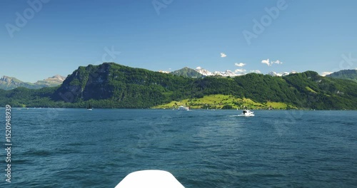 Wallpaper Mural 30-05-2025 Lucerne, Switzerland. Swiss Alps and lake view from aboard tourist ferry boat. Sunny summer day, middle of the lake POV, snowy mountain peaks, real time footage Torontodigital.ca