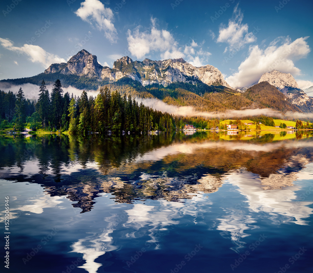 Fototapeta premium Reflexion of blue sky in the pure water of Hintersee lake.