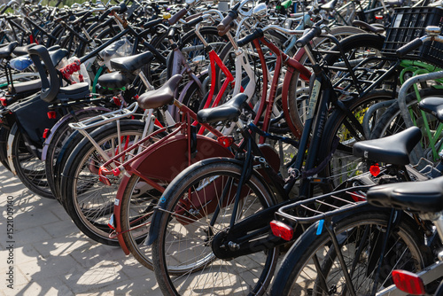 Fototapeta Naklejka Na Ścianę i Meble -  Large bike parking in Amsterdam near Sloterdijk station. Summer, sunny day.