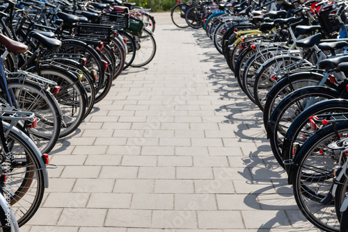 Fototapeta Naklejka Na Ścianę i Meble -  Large bike parking in Amsterdam near Sloterdijk station. Summer, sunny day.