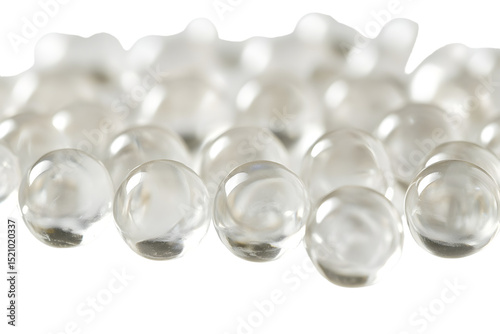 Macro shot of spherical hyaluronic acid bubbles with smooth surfaces suspended in clear gel isolated on white background photo