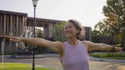 Asia adult aged people middle age mindful happy old woman yoga body pose zen calm stress relief outdoor nature public park sun light self love relax elder aging life asian female mental health care.