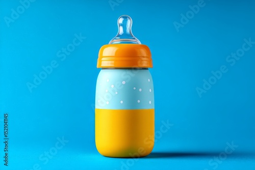 Bright colored baby bottle on a vibrant blue background showcasing playful design elements photo