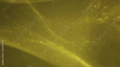Abstract Golden Dust Particles Floating Slowly In Warm Yellow Light