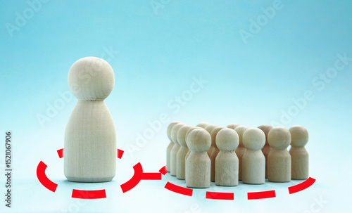 RED LINE: UNIFICATION OF INTERESTS. DECISION MAKING. A group of wooden figures in front of the leader's figure on a blue background .Leader concept, brainstorming