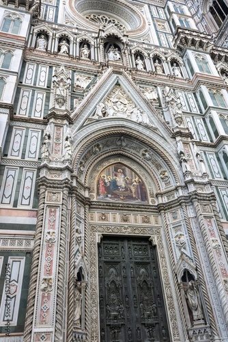 A fragment of the Cathedral of Santa Maria del Fiore facade with rich decoration, Florence, Italy