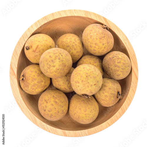 Longans in wooden bowl, top view, fresh and natural