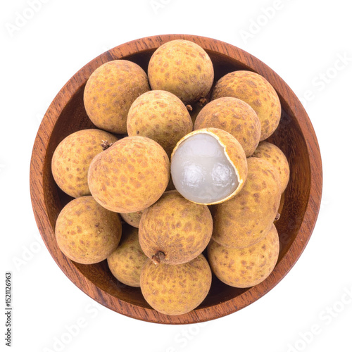 Longan fruit in wooden bowl, one peeled revealing flesh