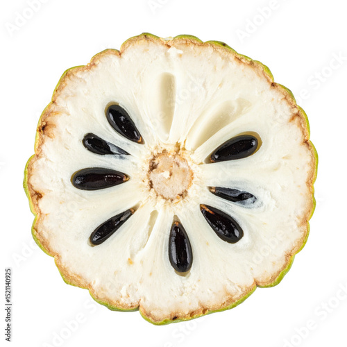 Sliced cherimoya with seeds visible inside
