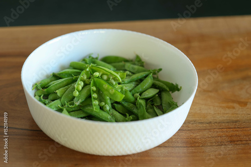 plate of peas on a wooden table. High quality photo