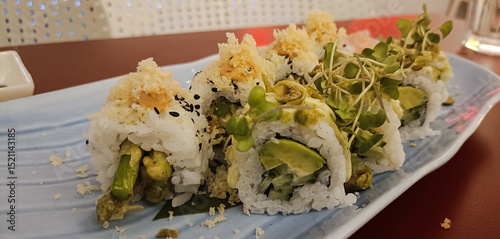 Asparagus sushi served in a plate in restaurant 