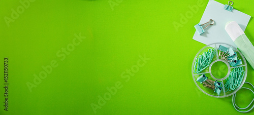 Wide banner with minimalist design of school supplies in brightgreen background photo