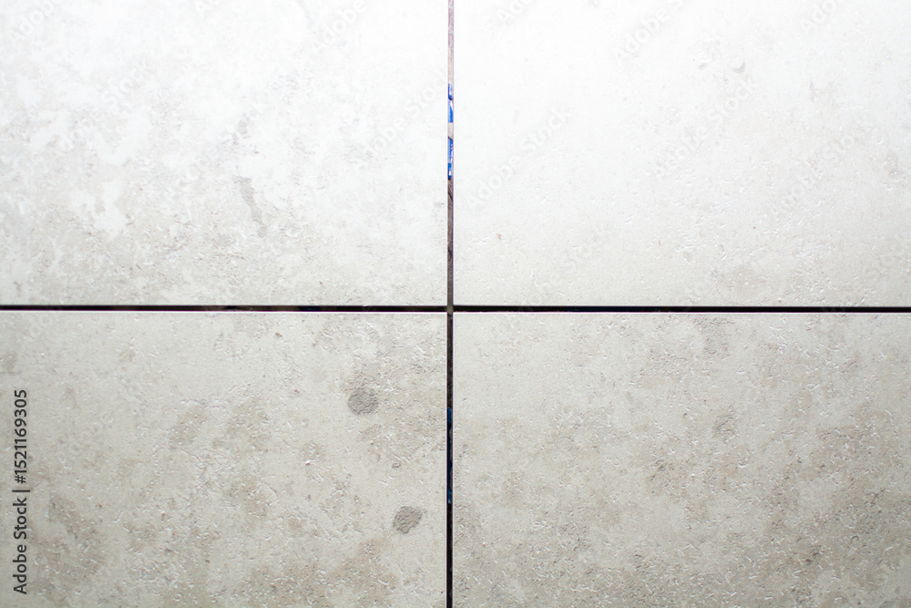 Fototapeta premium Close-up of ceramic tile installation before grouting