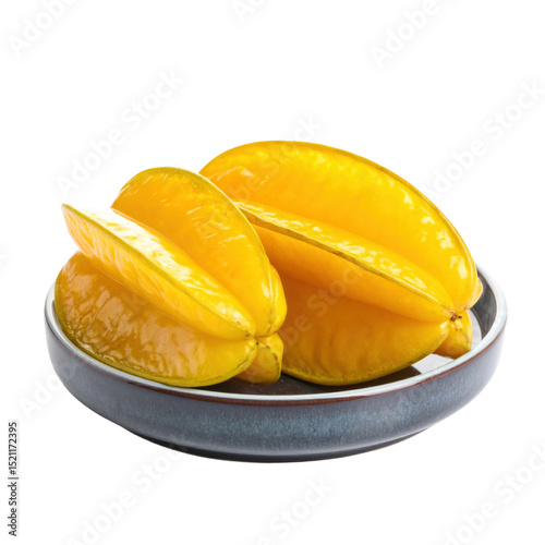 Yellow starfruit on ceramic plate, fresh and vibrant